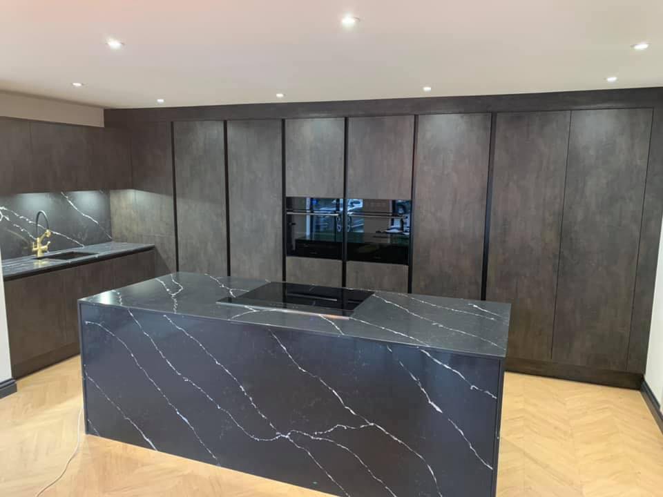 Dark Kitchen with Marble Island